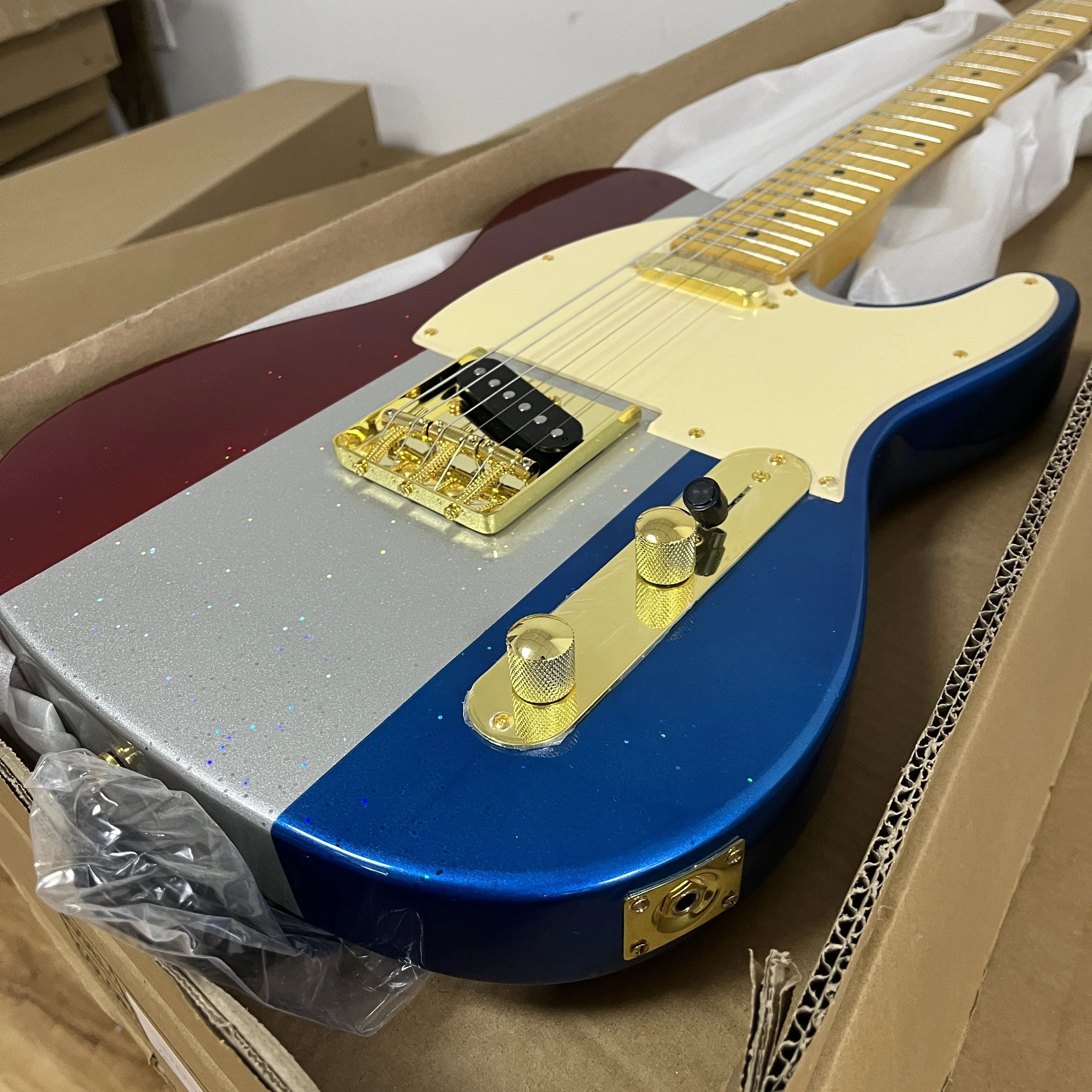 Red Wine Color Silver Reflective And Royal Blue Electric Guitar With White Protective Cover. Dual Single-Coil Pickups. Maple Neck And Fingerboard In Stock At the US Warehouse. Quick Delivery. Free Shipping.