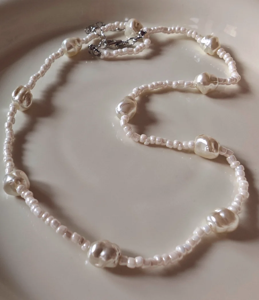 Baby's adem glazen parelketting