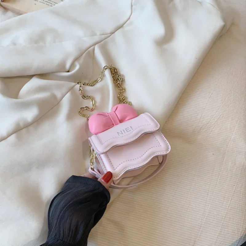 Mini bolsa de ombro PU para crianças, bolsa rosa, arco feminino, presente de aniversário, venda quente