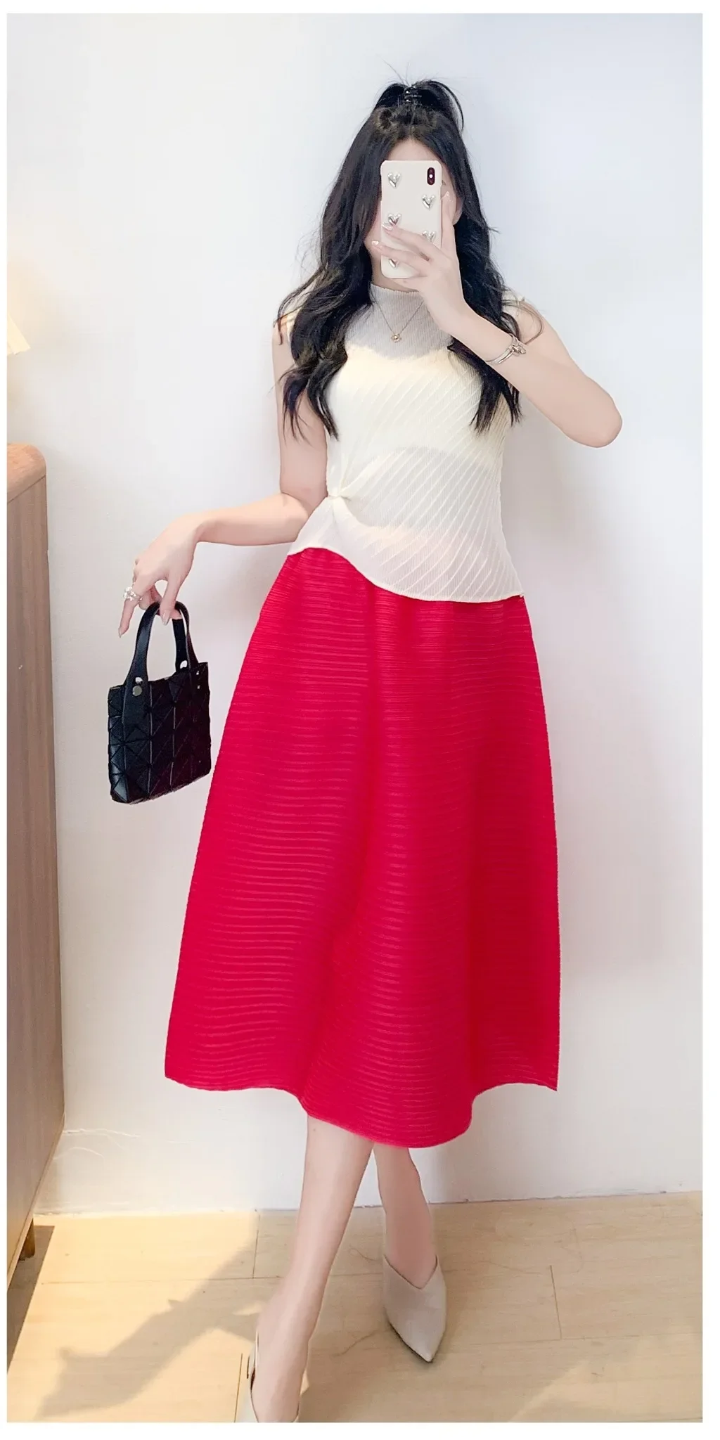 Doble Miyake plisada media falda de mujer 2025 primavera nuevo Horizontal minimalista Color sólido falda de diseño suelto 2025 novedad de verano