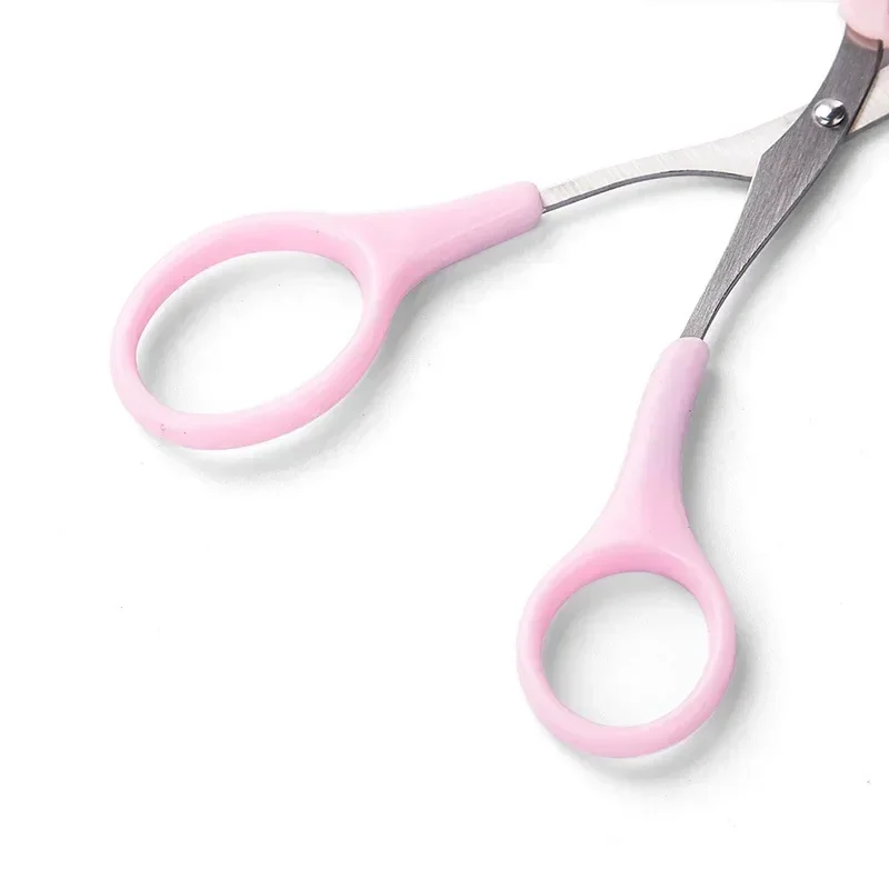 Pink eyebrow trimming scissors with built-in comb - stainless steel, precise grooming tool, creating perfect eyebrows