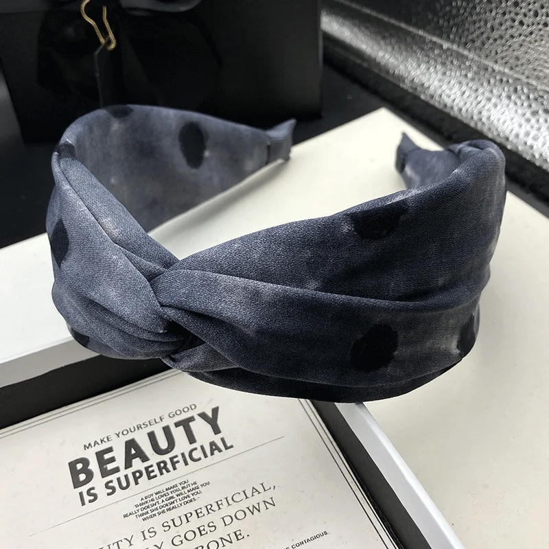 New wide edged polka dot headband for women, worn externally with a high skull top to show off a small face, versatile and niche