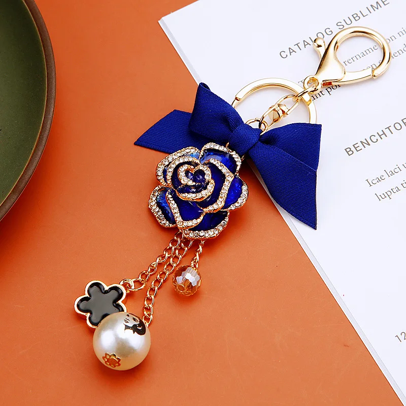 الأزياء القوس عالية Guishan الشاي زهرة سيارة المفاتيح حقيبة قلادة اللؤلؤ هدية صغيرة التبعي