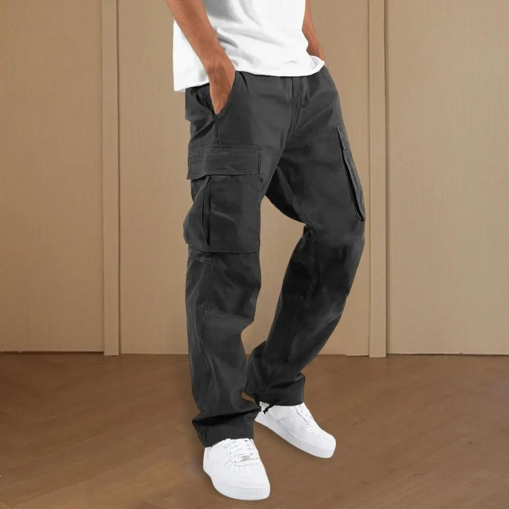 

Мужские брюки с эластичным поясом. Универсальные мужские брюки-карго с завязками на талии. Дизайн с несколькими карманами. Повседневный стиль на каждый день для мужчин.