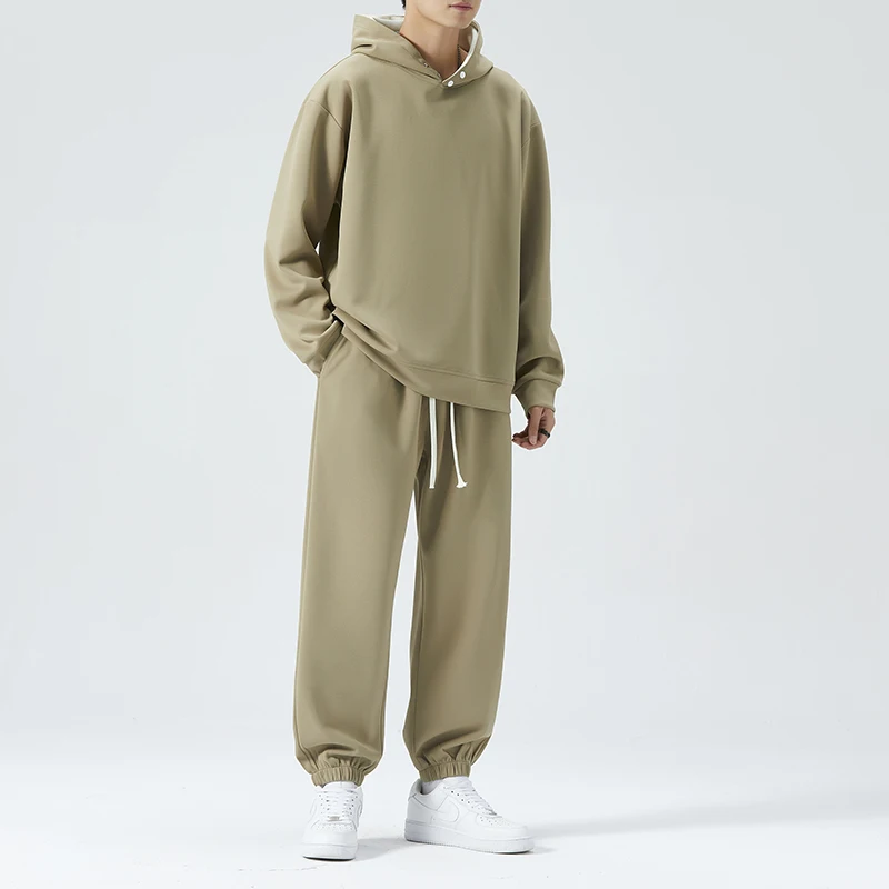 Neue koreanische Mode Mode Frühling Herbst Jugend Freizeit Sport zweiteiliges Set für Männer losen und vielseitigen Kapuzen pullover Anzug