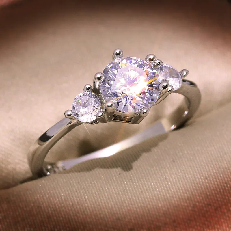 Elegant geometric ring for women featuring white copper base with lab-created moissanite stones totaling approx 0.9 carat weight