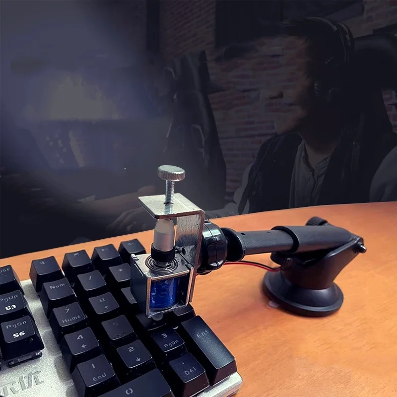 Silent-button, timer-controlled gaming PC that automatically simulates physical keyboard clicks in place of manual input