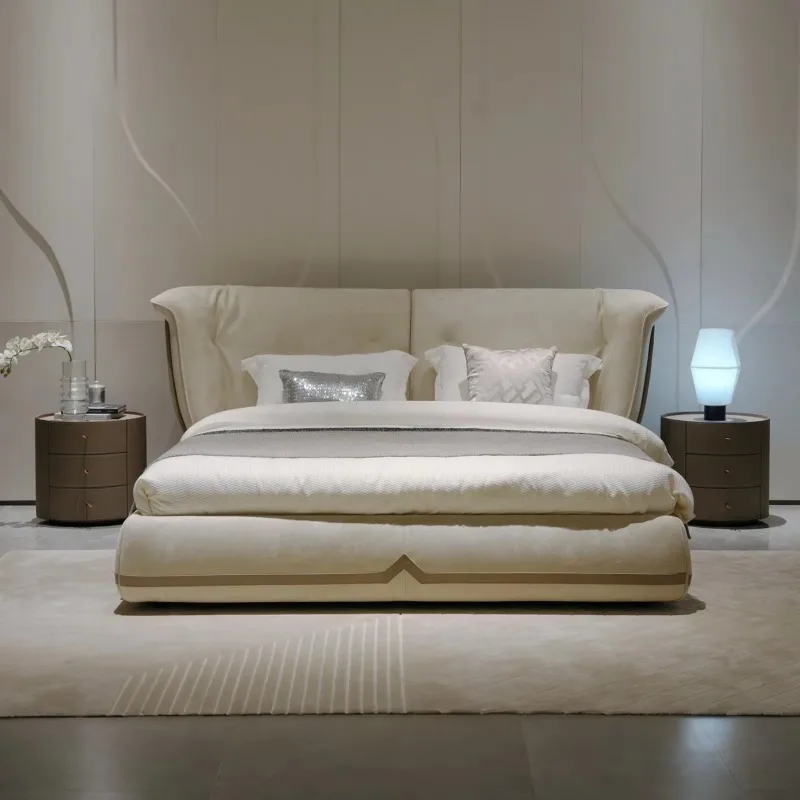 Elegant curved upholstered double bed, low mattress frame, solid wood base, large leather bed