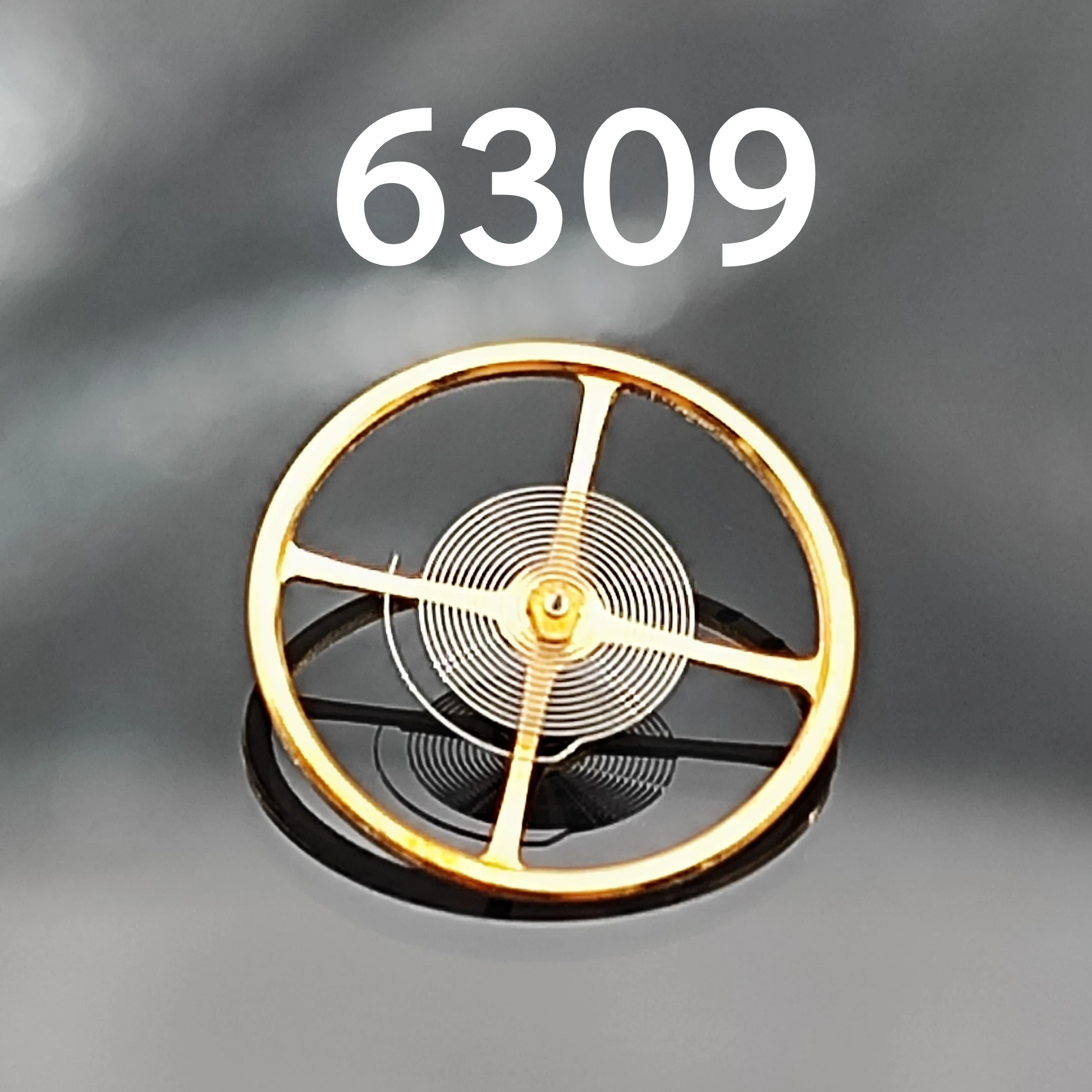 Accesorios para relojes hechos en China 6309 Rueda de equilibrio Movimiento mecánico antiguo 6309 Rueda de equilibrio de oscilación completa (con cable de aceite)