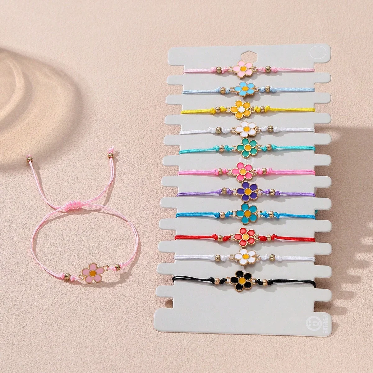 

Набор из 12 регулируемых браслетов с цветочными подвесками для взрослых