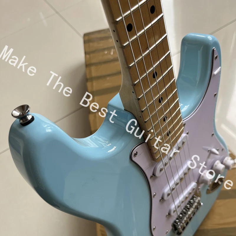 Exquisite bright blue electric guitar, tremolo bridge, professional level, fast delivery.