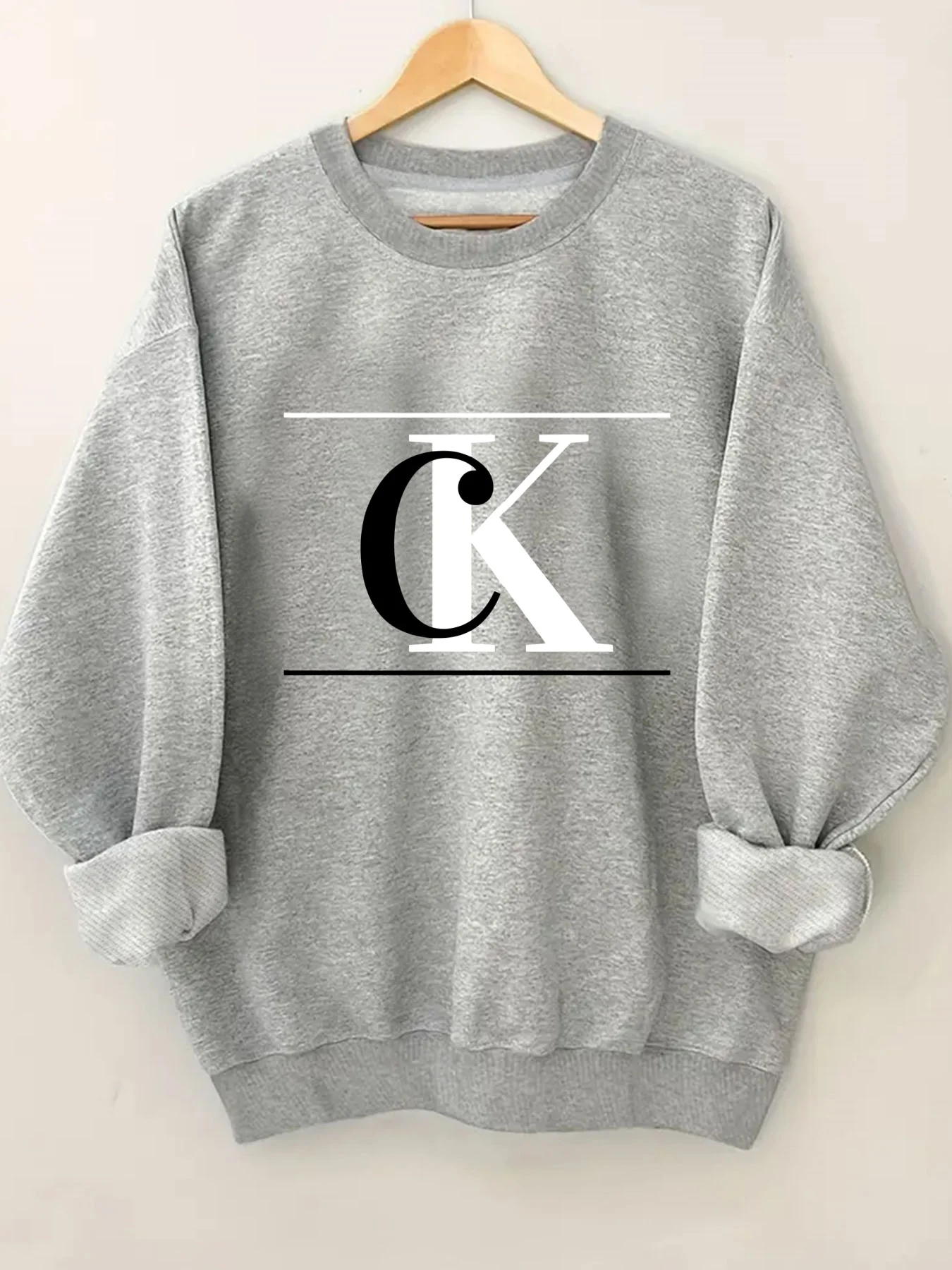 Sudadera de cuello redondo con estampado de letras geométricas a la moda para mujer, jersey de cuello redondo estampado elegante, ropa de calle informal