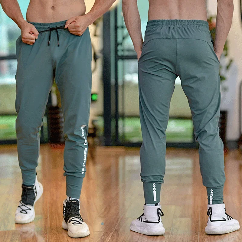 Pantalón deportivo para hombre con bolsillos y cremallera, pantalones de entrenamiento para culturismo, pantalones largos para correr, pantalones de