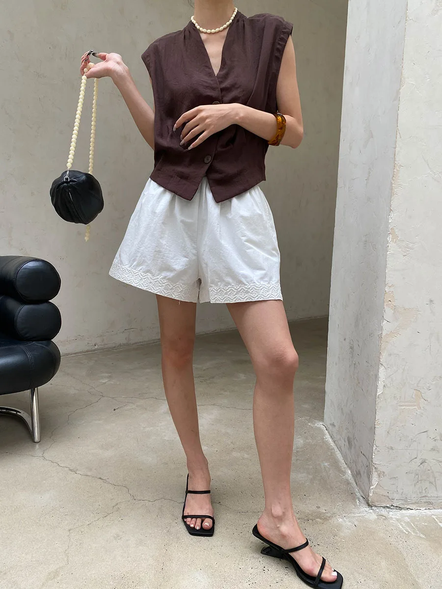 Sommerliche Damen-Shorts in unifarbenem Design mit elastischem Bund, besticktem Patchwork, lockerer Passform und weitem Bein. – Detail 17