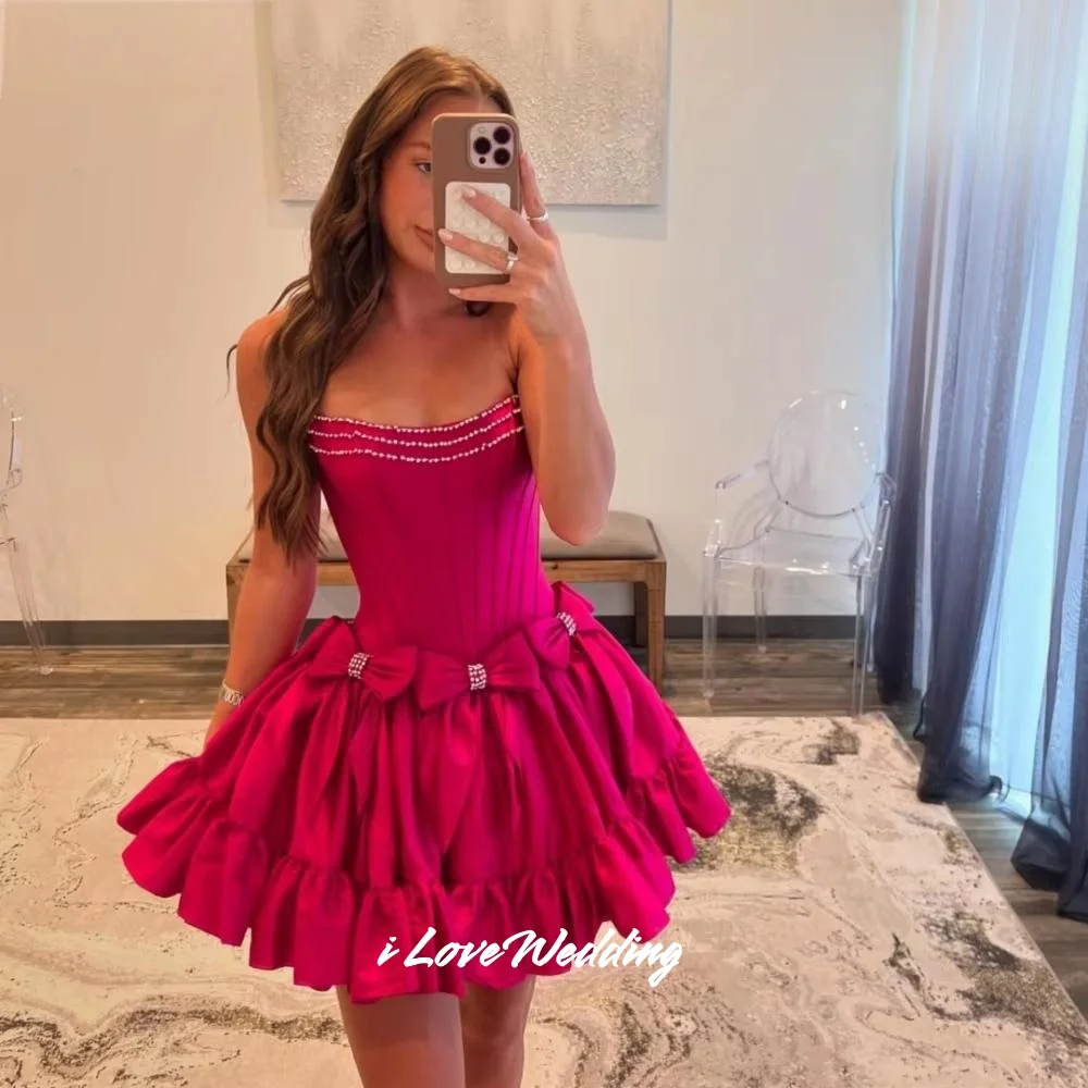 Rosa Perlen trägerloser Minirock Taft ärmellose Schleife Heimkehrkleider A-Linie plissiert modernes Geburtstagspartykleid individuell