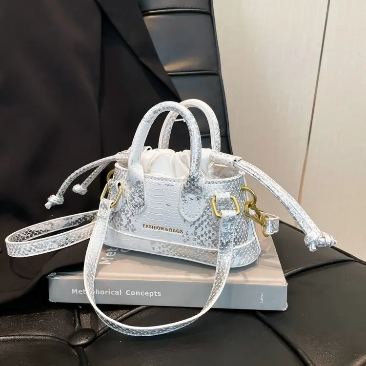 

Минималистичная женская сумка-ведро – сумка с верхней ручкой и ремнем через плечо, новая летняя повседневная сумка для поездок на работу, уникальный дизайн, универсальная.