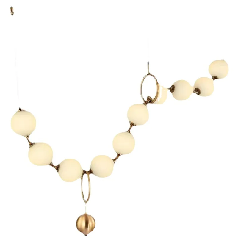 

Magic beans, restaurant, French, chandelier, modern, minimalist, pearl, necklace, bar, dining table, lamp strip