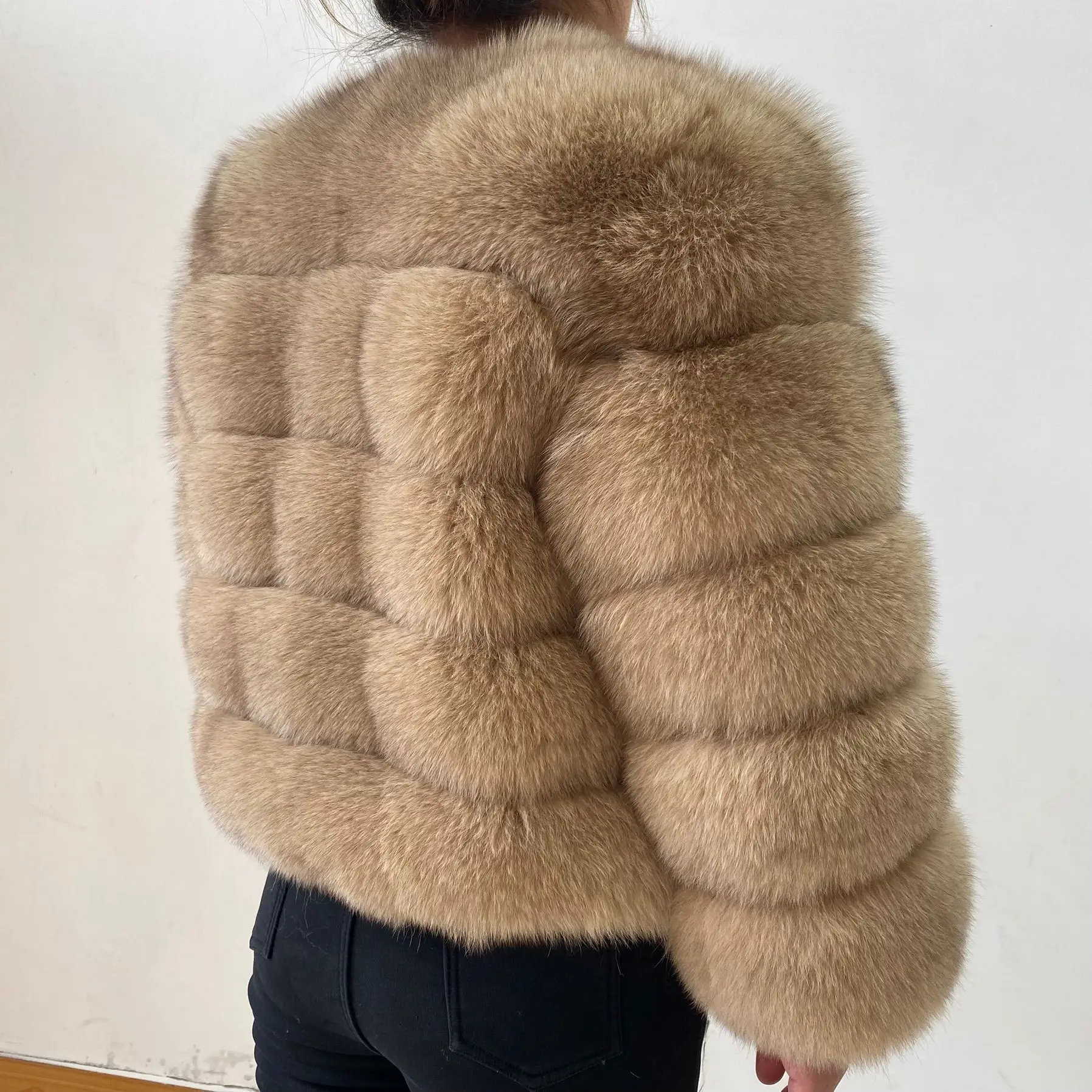 The lady's fashionable natural genuine fox fur women's winter fur coat. Fashionable fox fur natural fur women's coat. Genuine fo