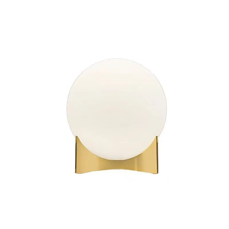 Lighting hotel bedroom bedside sofa next to metal glass ball table lamp