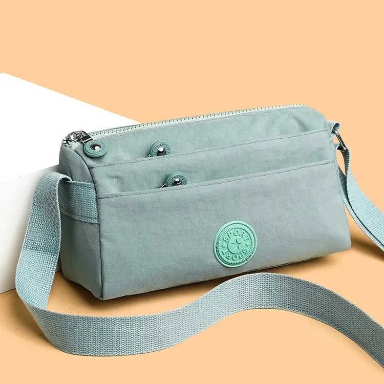 nova-bolsa-transversal-de-lona-para-mulheres-nylon-versatil-impermeavel-forro-de-poliester-io-fechamento-com-zipe