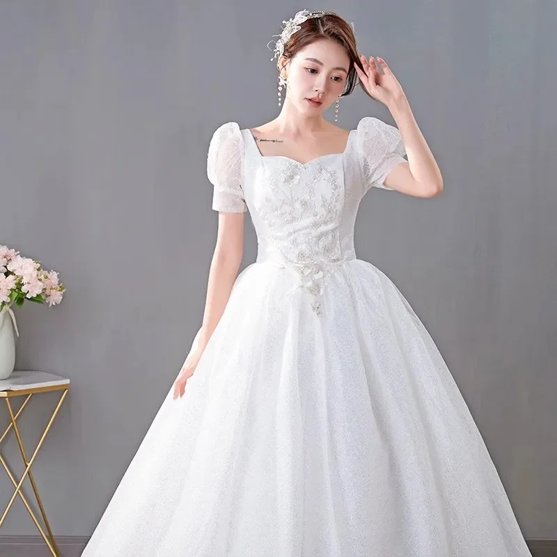 Vestidos de novia de tul ostentoso blanco, cuello cuadrado, mangas cortas, Princesa, longitud hasta el suelo, talla grande, vestido de baile de novia Simple, XN056