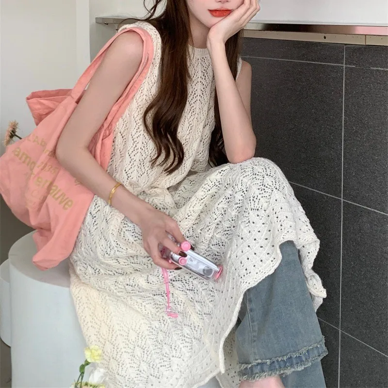 ชุดเดรสชายหาดกลวงออก สาวเผ็ดยุโรปและอเมริกา ทรงยาว คอกลม สไตล์แขนกุด เสื้อสเวตเตอร์ถัก กระโปรงเสื้อกั๊ก