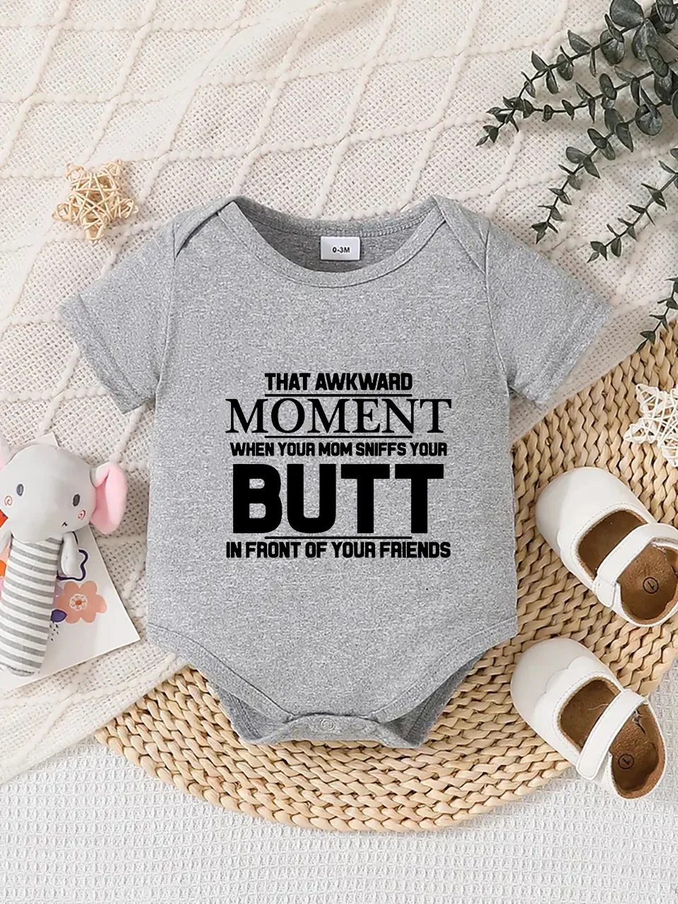 Playful letter-printed baby short-sleeve triangle bodysuit. Button closure for easy dressing, machine washable