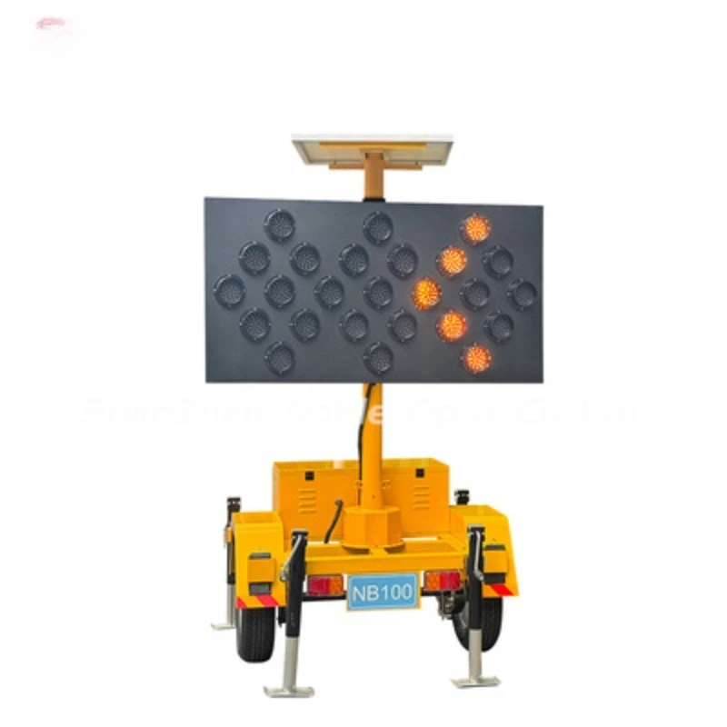 Guide signs with solar panels and battery carts direct traffic and ensure drivers