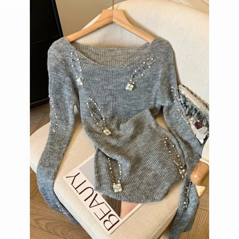 

French gray heavy industry beading hole design sense hollow sweater women's autumn and winter irregular sweater pure desire top