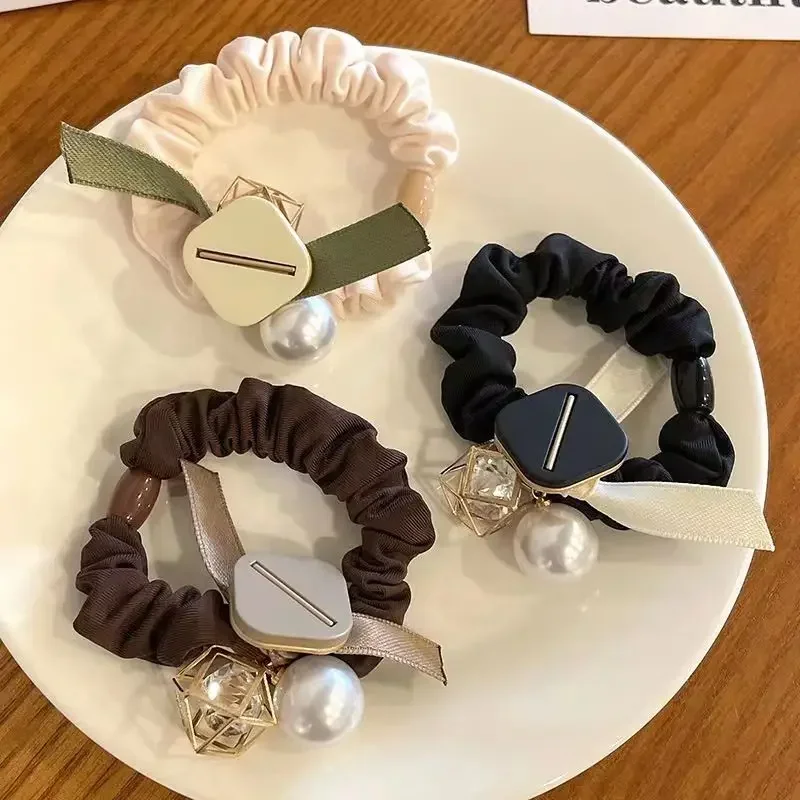 

Japanese and Korean style high-end pearl large intestine hair band, simple temperament, hair ornament, bow cloth hair rope