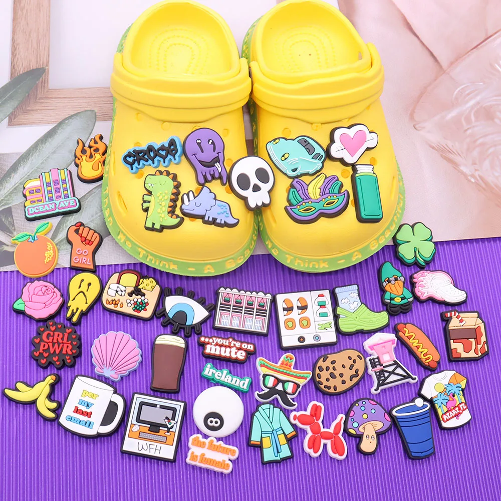 

Mix 50pcs PVC Shoe Charms Eyes Cart Sushi Cup Ghost Tee T-Shirt Hot Dog Dinosaur Shell Buckle Clog Decorations for Bands Gift