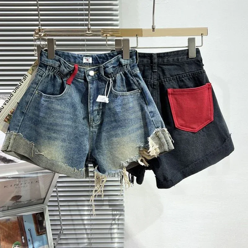 

High waisted denim shorts for women summer 2024 folded large red bag. Hairy fringe A-line short pants