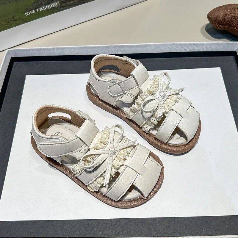 

Kids Leather Cage Sandals for Girls 2025 Summer Non-slip Toddler Beach Shoes with Cute Bow Princess Elegant Party Wedding Shoes