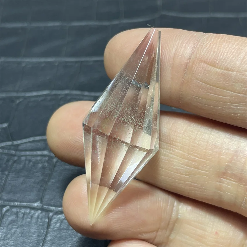 

Natural white crystal raw stone piece with double-pointed laser drilling of 12 facets and hexagonal prism. Mineral stone from Vo