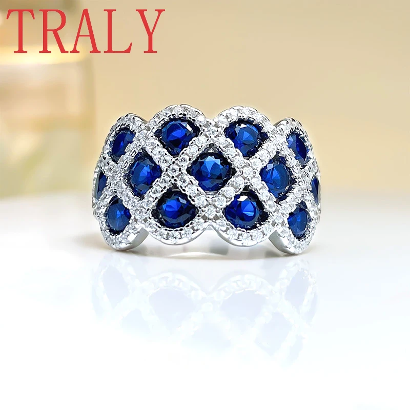 

PT950 Platinum Colored Treasure Ring Personalized Fashion Ring Full of Diamonds, European and American Red and Sapphire