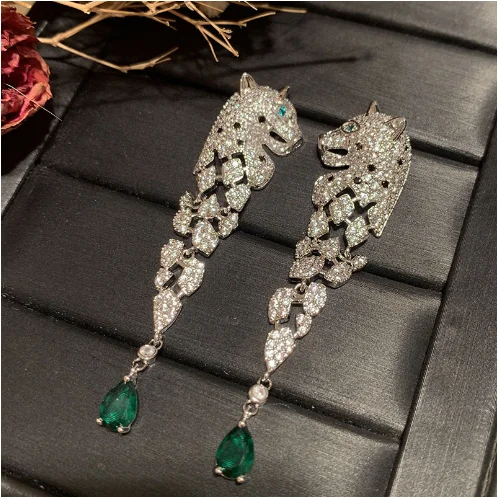 

2023 Cartoon cat earrings S925 silver needle domineering long tassel hollowed-out grandmother green water drop earrings