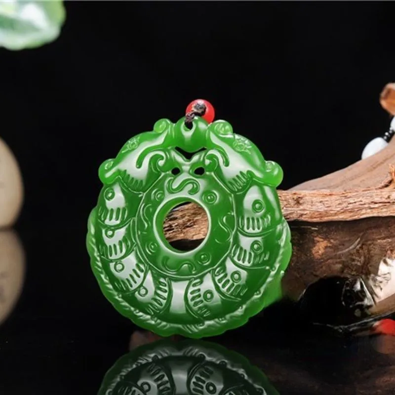 

Xinjiang Hetian jade jasper pendant spinach green hollow double dragon safety buckle