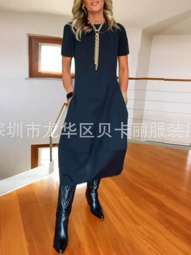 فستان نسائي صيفي جديد لعام 2025 فستان فضفاض غير رسمي بأكمام قصيرة ورقبة دائرية تي شيرت أنيق بلون واحد ملابس مكتب للسيدات