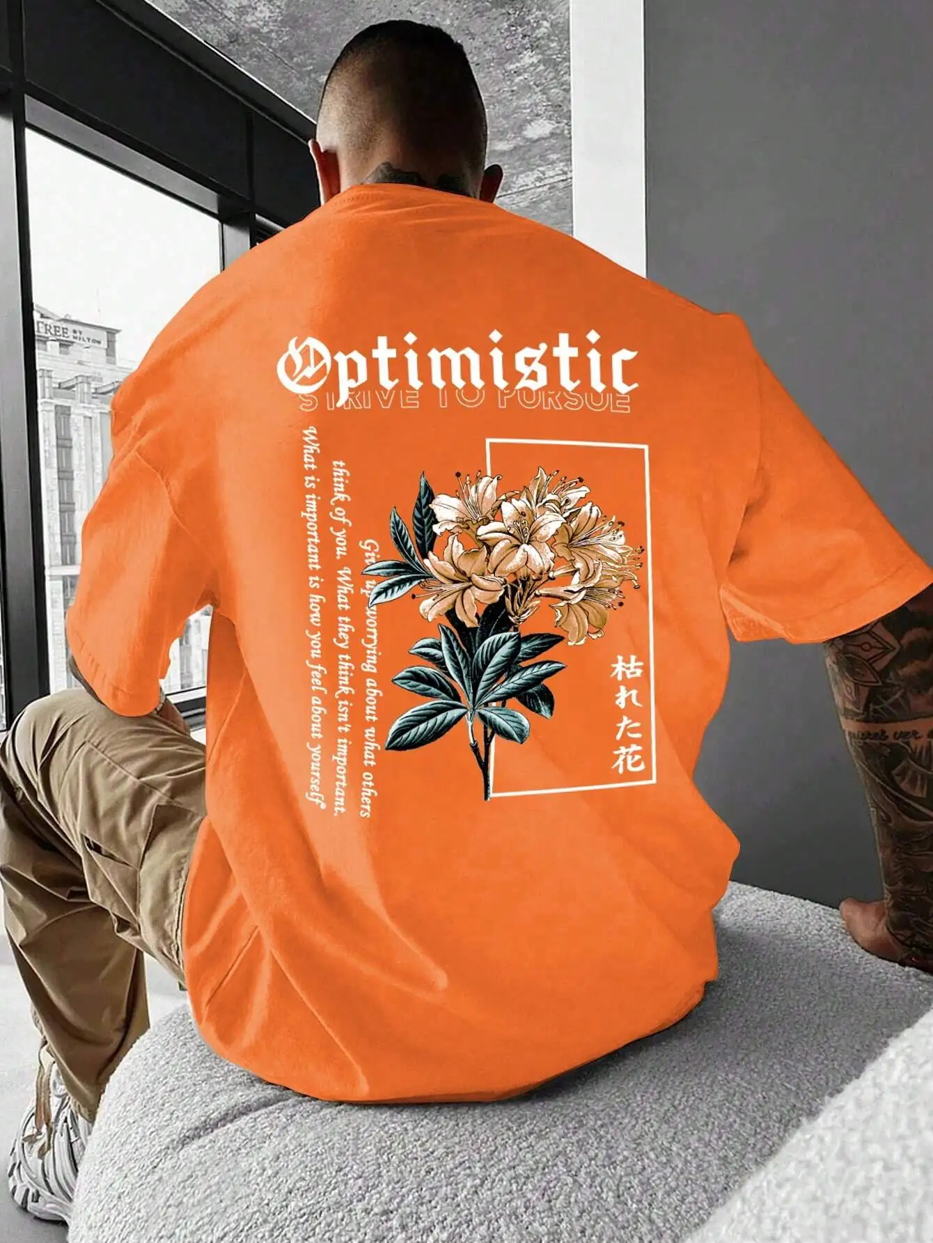 

Orange Oversized Floral Graphic Tee with Motivational Slogan, Casual Streetwear