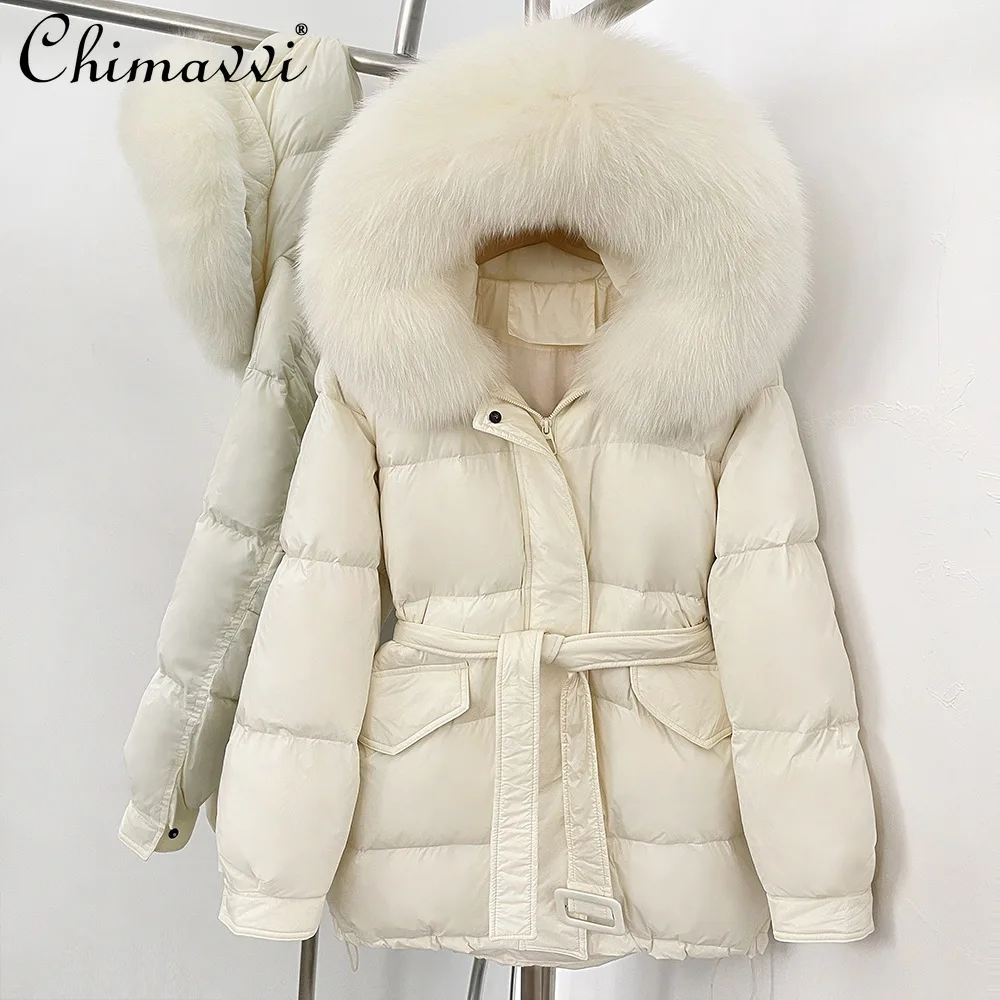 Stile coreano elegante collo di pelliccia di volpe di fascia alta con cappuccio giacche longuette inverno casual allentato spesso caldo cintura sottile piumini da donna