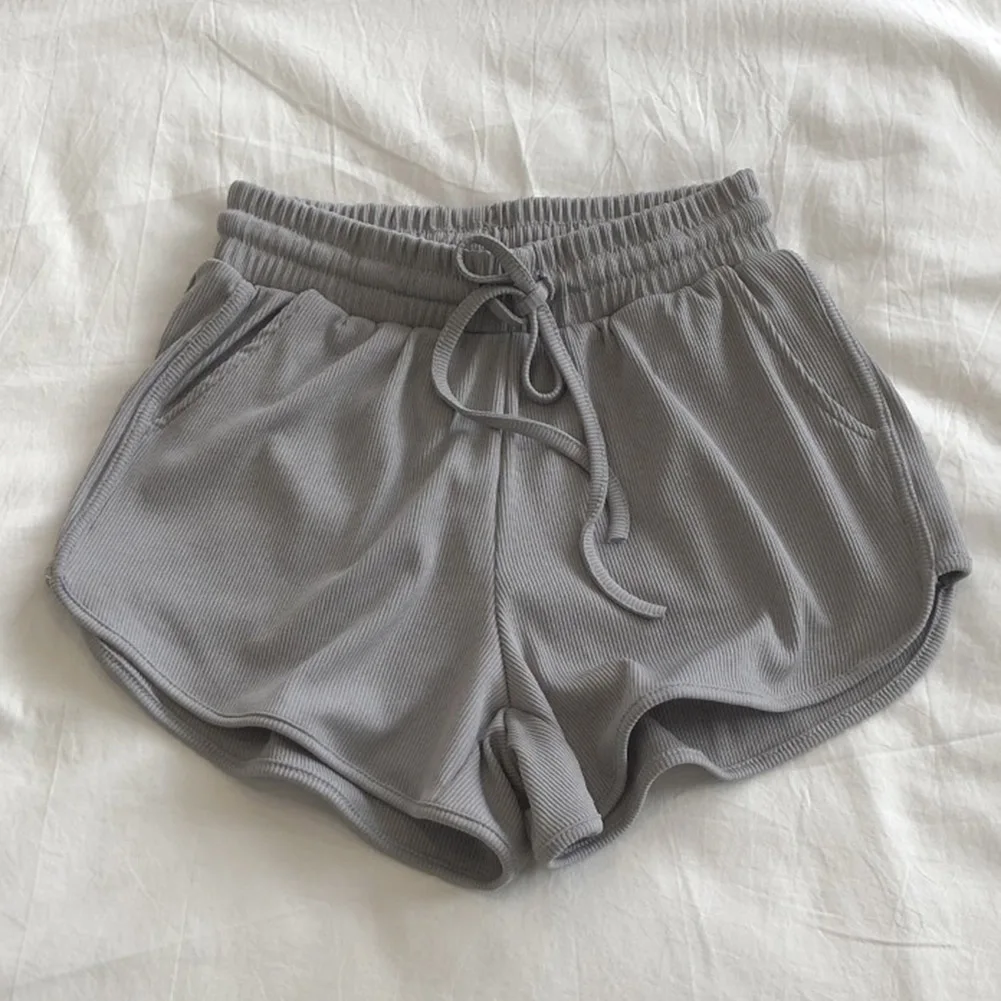 Cómodos pantalones cortos de pierna ancha de color sólido para mujer con detalle de cordones y material de hilo de seda helada para uso en primavera al invierno