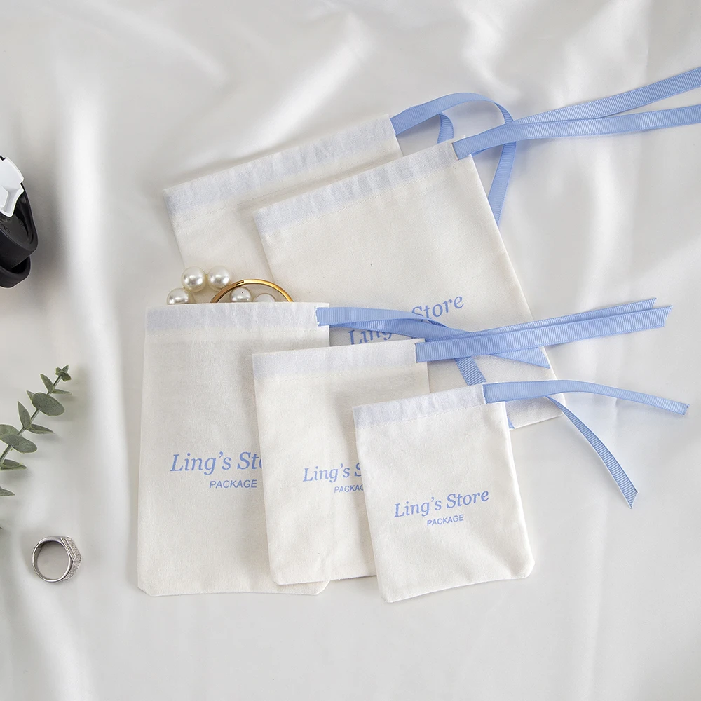 100Pcs Custom Logo White Cotton Jewelry Muslin Bag Canvas Ribbon Pouch For Ring Earrings Watch Sunglasses Headset Gift Organizer view 5
