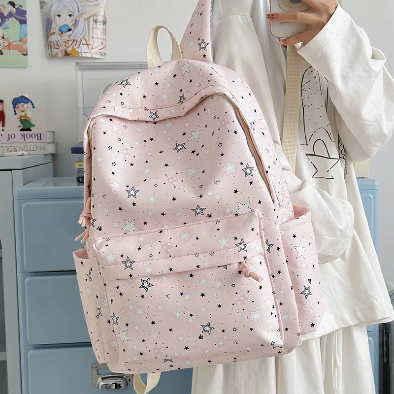 Compact nylon star-shaped student backpack with large capacity and water-resistant feature for commuting and travel by women