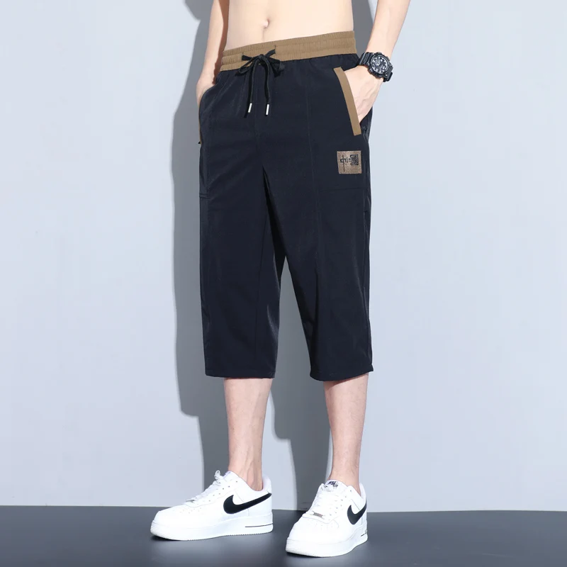 Fotografia 4: Shorts Masculinos de Tênis para Treino ao Ar Livre, com Tecnologia de Secagem Rápida e Respirável, Estilo Solto e Moderno, Comprimento de Sete Polegadas