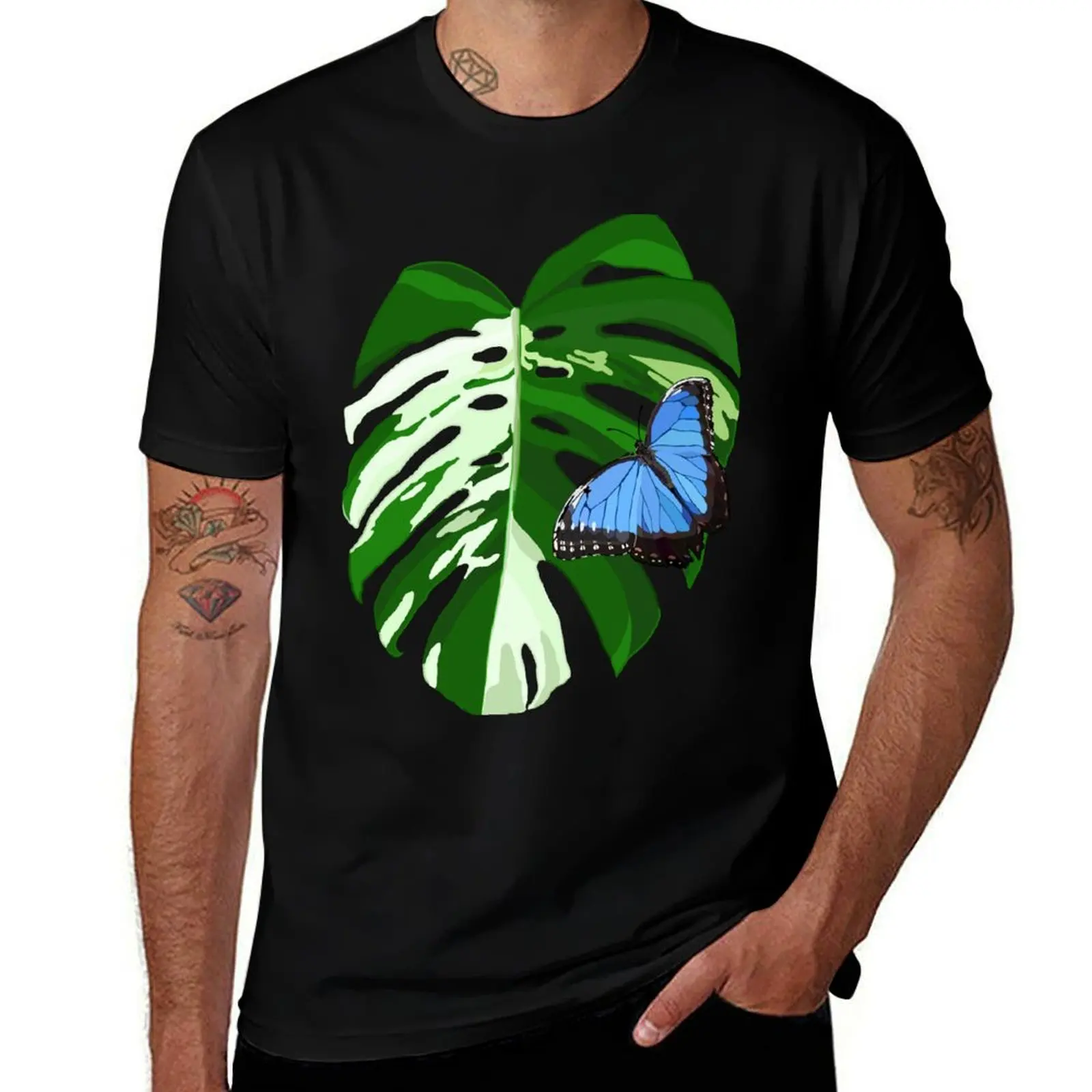 

Blue Morpho Butterfly on a Monstera Albo Leaf T-Shirt funny meme t-shirts custom t shirt T-shirt men