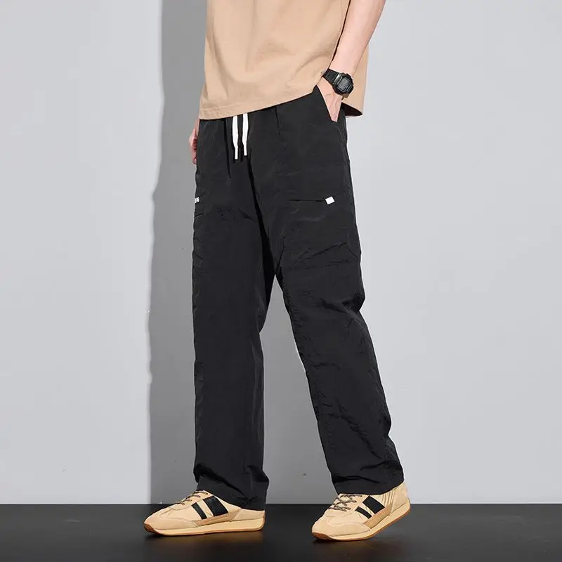 ربيع جديد نمط الرباط واسعة الساق جيب النايلون عارضة السراويل للرجال