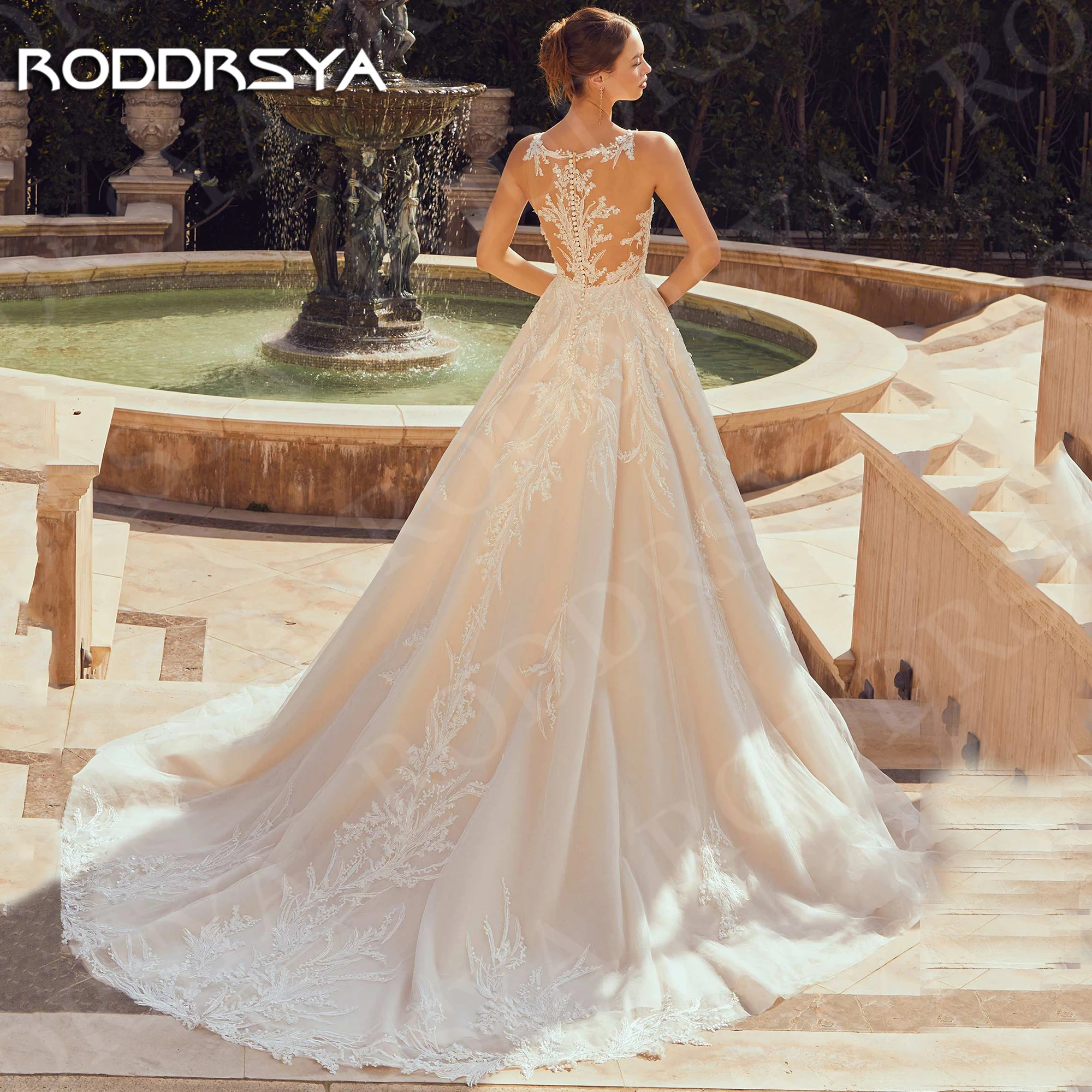 RODDRSYA Luxe Trouwjurk 2025 A Line robe de mariée Lace Illusion Back Tulle Bruidsjurk Mouwloze V-hals Aangepaste Vrouw Luxe Bruidsjurk 2025 A Lijn Kant Illusie Terug Tule Bruidsjurk Mouwloos V-hals Aangepaste Vrouw