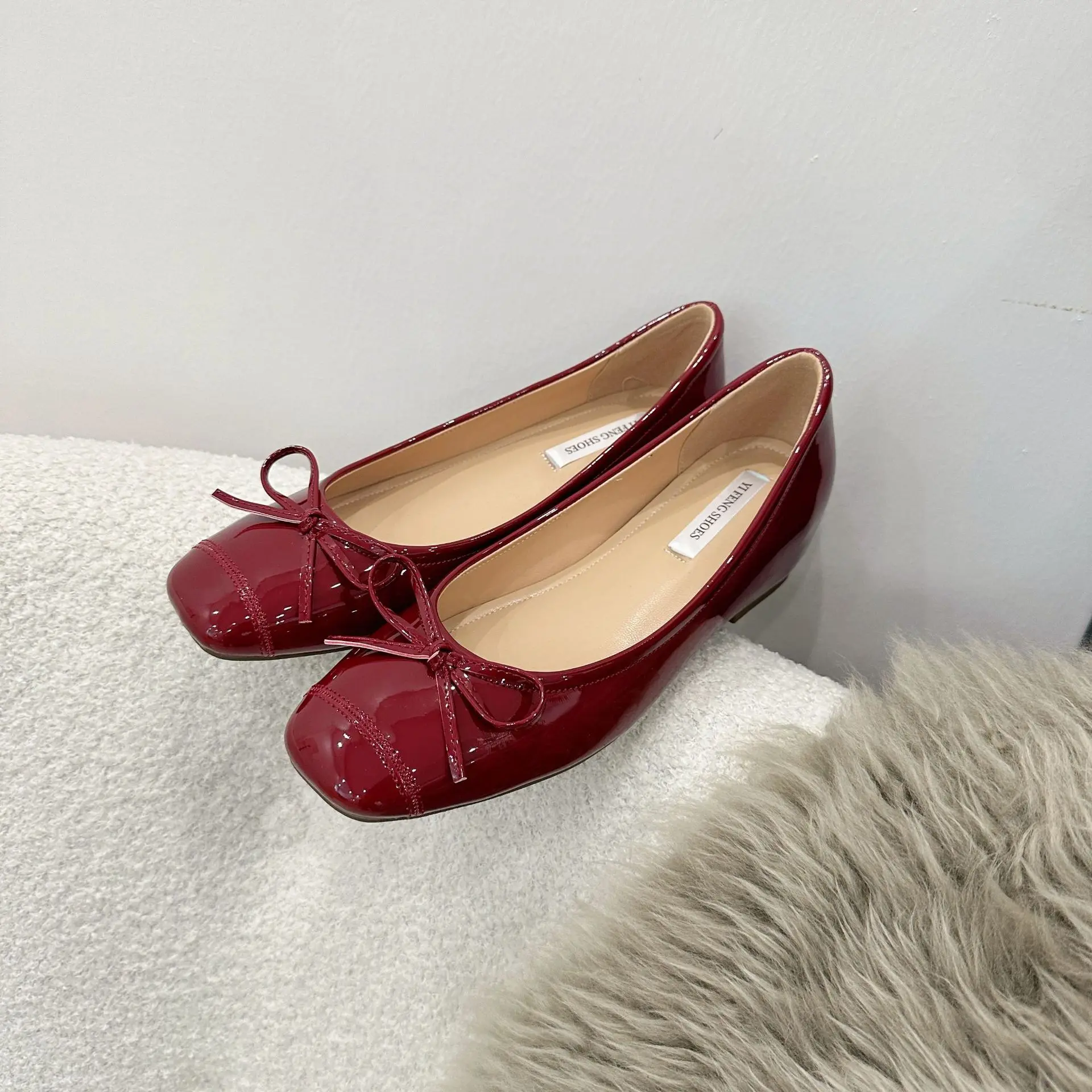 Ondiepe vrouwelijke zachte ronde neus dames flats met schoenen dia's schoenen mode vlinderknoop dames ballet flats dansschoenen