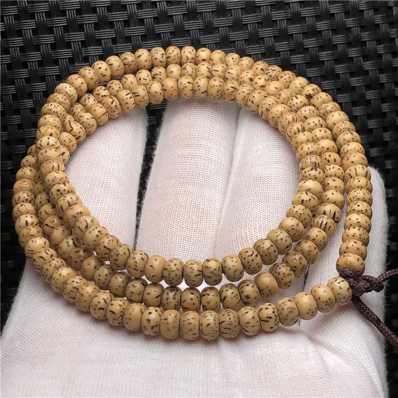 

Factory Wholesale Hainan Golden Seed Mini Star Moon Bodhi Bracelet Chicken Oil Old Seeds Multi-Circle Women's Bracelet4*6