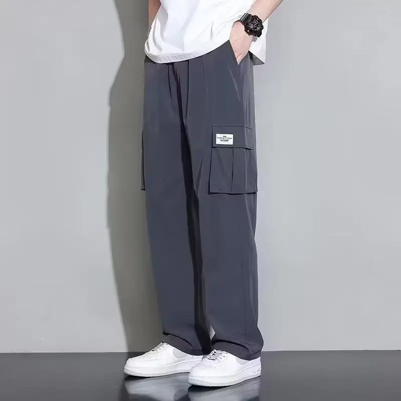 Frühling Sommer neue Mode elastische Taille solide Freizeit hose Herren bekleidung lose koreanische Stil gerade Taschen alle passen Hosen